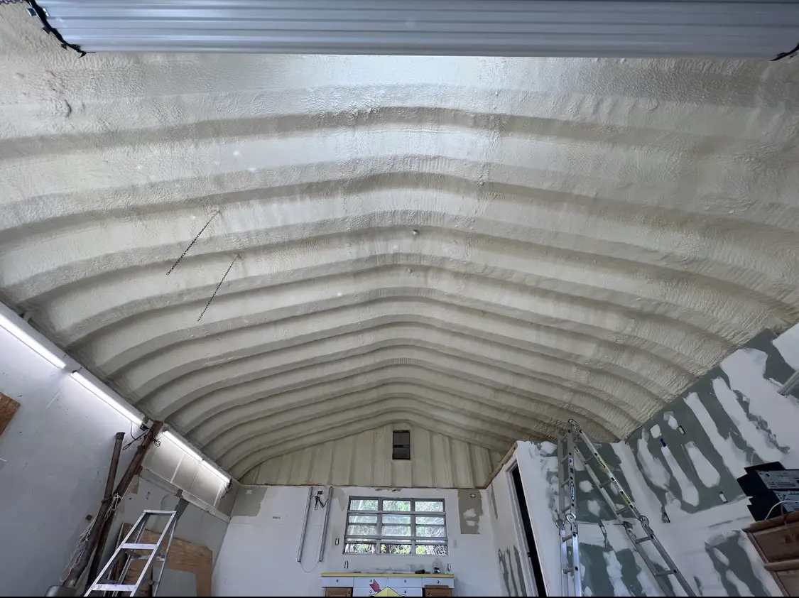 Spray polyurethane foam applied to the underside of a metal roof deck in Nicholasville